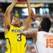 Michigan sophomore Trey Burke shoots over Florida junior Will Yeguete during the first half against Florida at Cowboys Stadium on Sunday, March 31, 2013. Melanie Maxwell I AnnArbor.com
